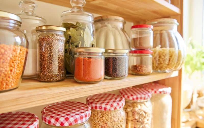 several glass jars in shelves_rugal Kitchen Hacks to Save Money