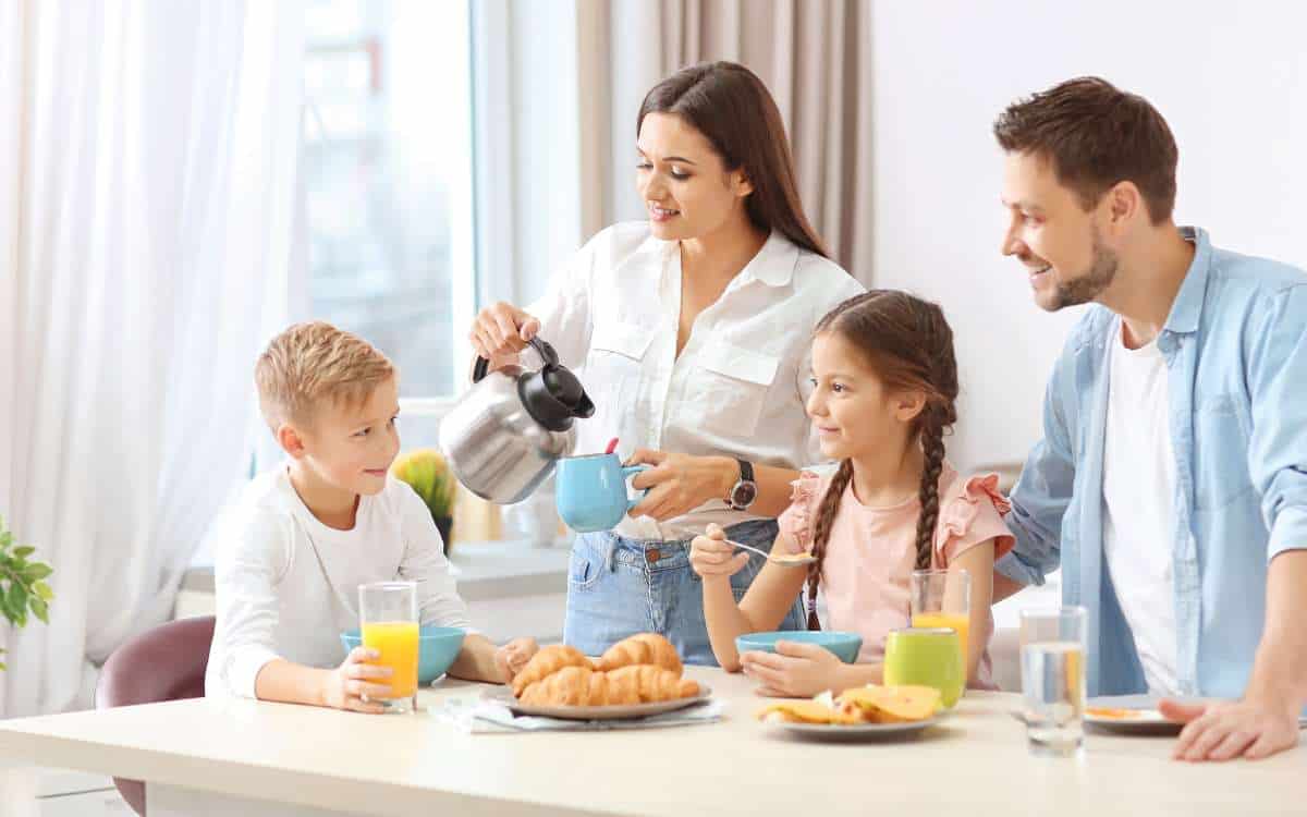 A family of 4 happily taking their breakfast