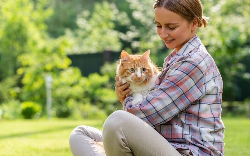 young woman with her pet cat